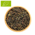 Bio Darjeeling Tee-Mischung: lose Blattteeblätter in Holzschale, dunkelbraun